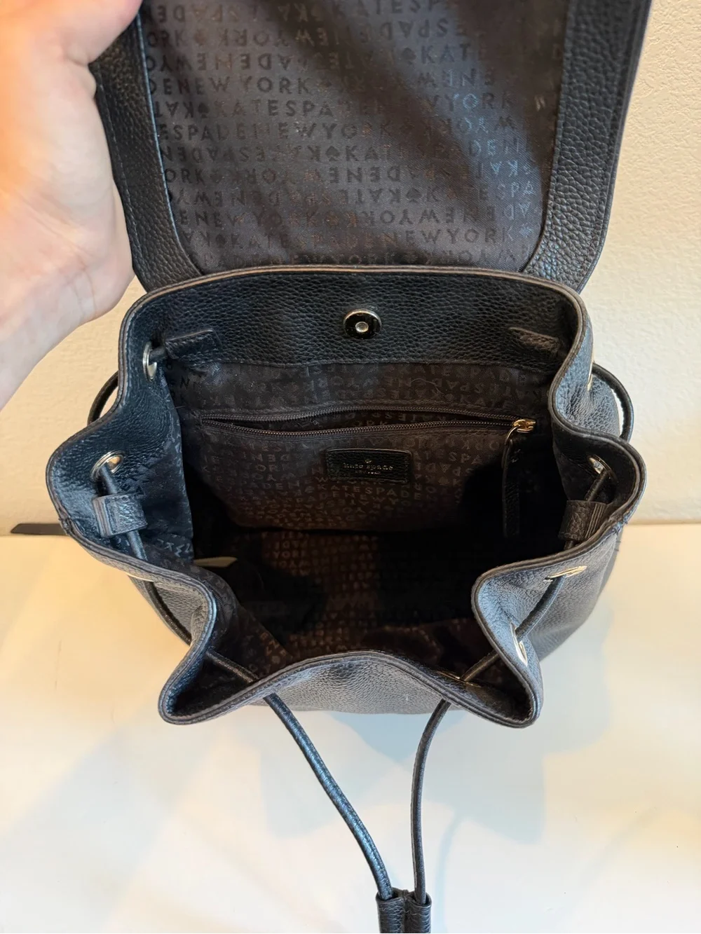 kate spade Black Pebbled Leather Drawstring Backpack with Flap